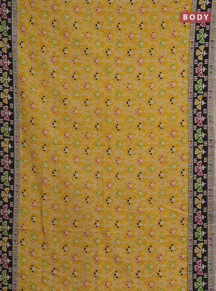 Kalamkari cotton saree yellow and black with allover prints and printed border