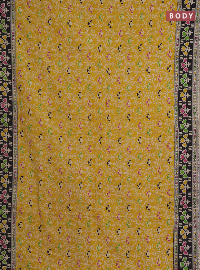 Kalamkari cotton saree yellow and black with allover prints and printed border