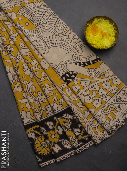 Kalamkari cotton saree yellow and black with allover prints and printed border