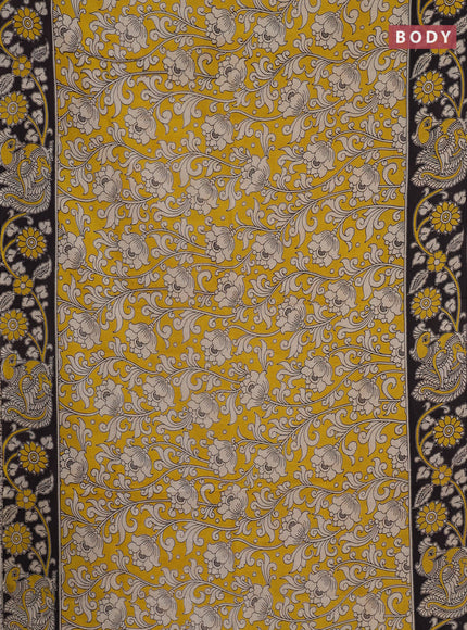 Kalamkari cotton saree yellow and black with allover prints and printed border