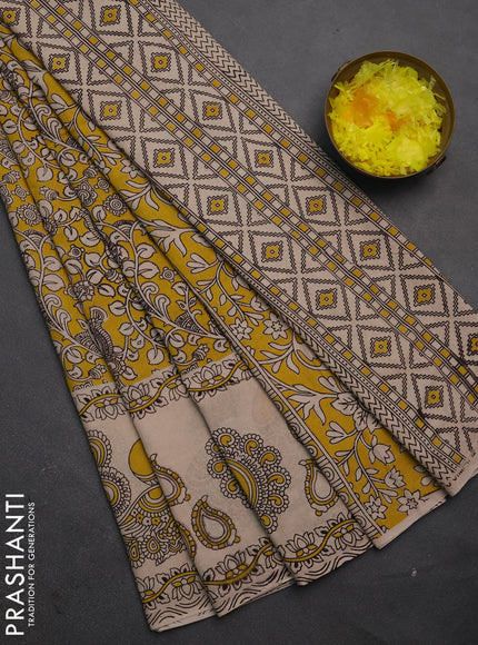 Kalamkari cotton saree yellow and beige with allover prints and long printed border