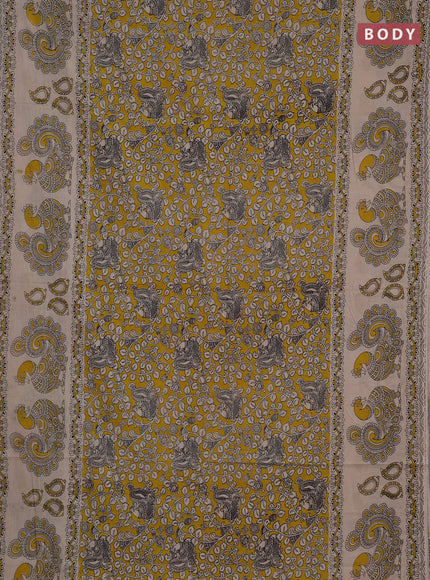 Kalamkari cotton saree yellow and beige with allover prints and long printed border