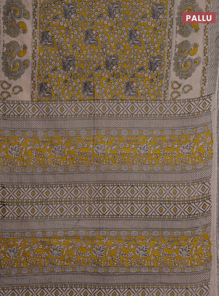 Kalamkari cotton saree yellow and beige with allover prints and long printed border