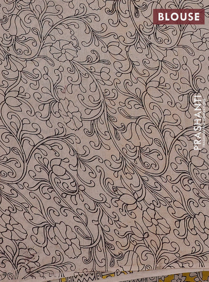 Kalamkari cotton saree yellow and beige with allover prints and long printed border