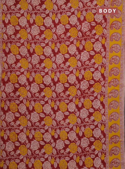 Kalamkari cotton saree maroon and yellow with allover prints and butta printed border