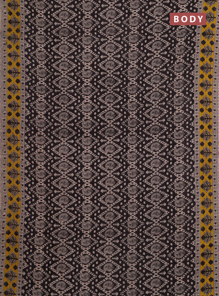 Kalamkari cotton saree black and yellow with allover prints and printed border