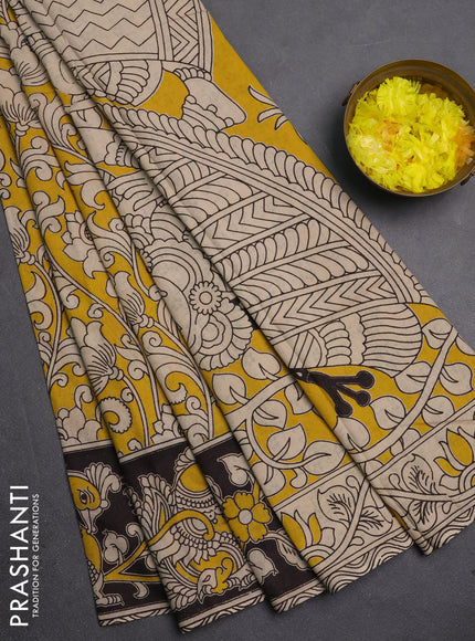 Kalamkari cotton saree yellow and black with allover prints and printed border