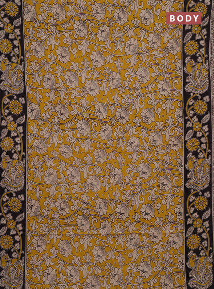 Kalamkari cotton saree yellow and black with allover prints and printed border
