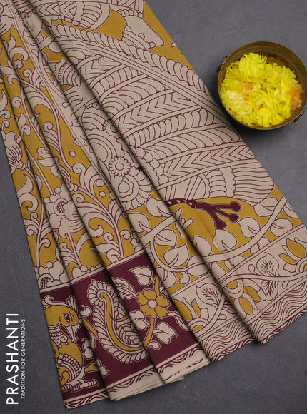 Kalamkari cotton saree yellow and wine with allover prints and printed border