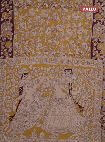 Kalamkari cotton saree yellow and wine with allover prints and printed border