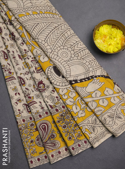 Kalamkari cotton saree beige and yellow with allover prints and long printed border