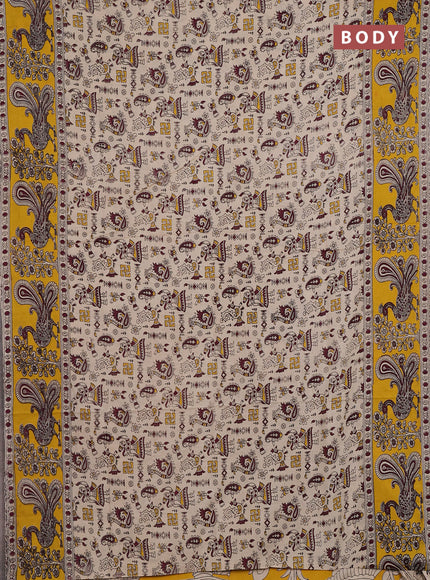Kalamkari cotton saree beige and yellow with allover prints and long printed border