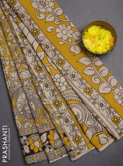 Kalamkari cotton saree yellow and black with allover prints and printed border