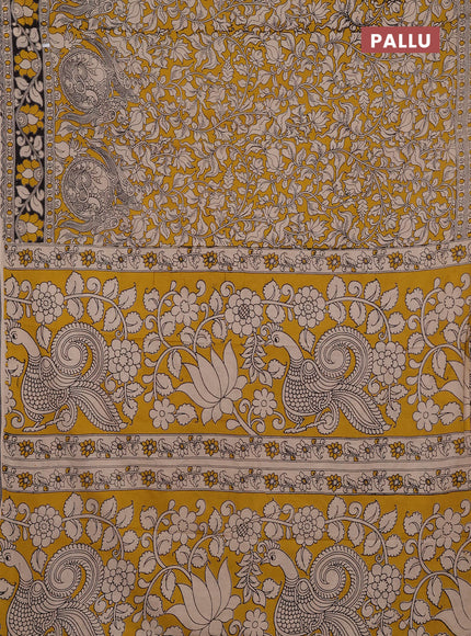 Kalamkari cotton saree yellow and black with allover prints and printed border