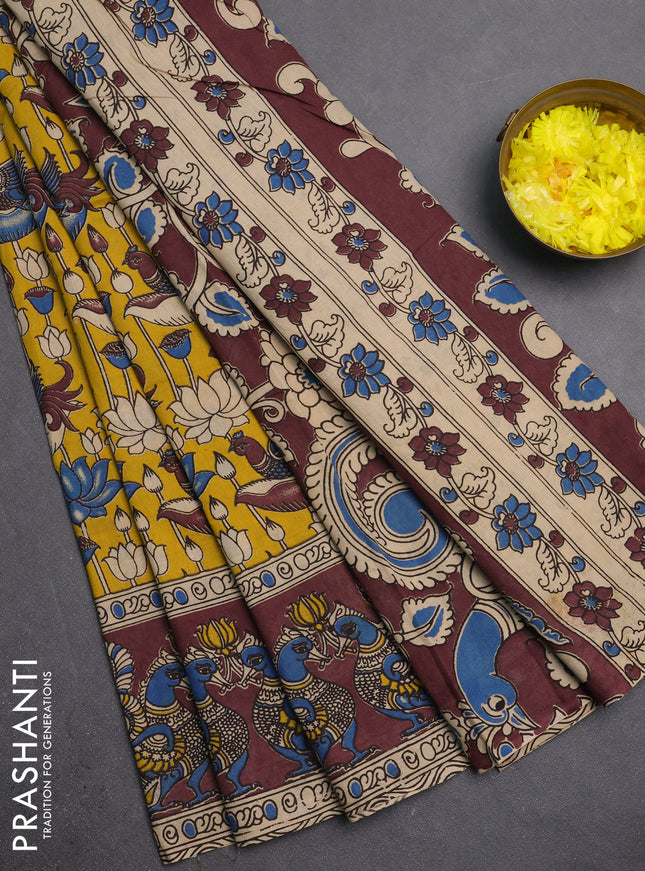 Kalamkari cotton saree yellow and brown with allover prints and long printed border