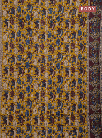 Kalamkari cotton saree yellow and brown with allover prints and long printed border