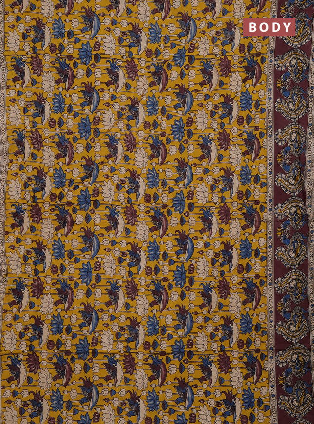Kalamkari cotton saree yellow and brown with allover prints and long printed border
