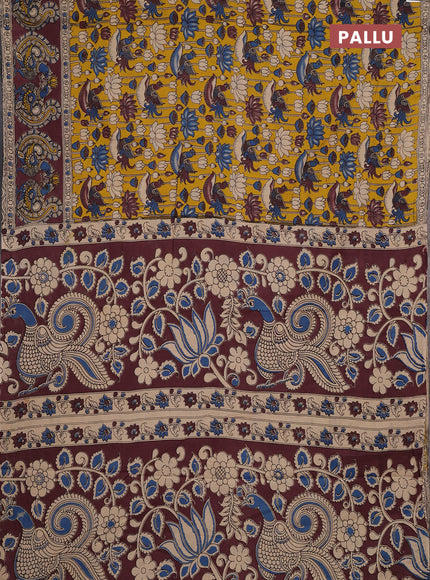 Kalamkari cotton saree yellow and brown with allover prints and long printed border