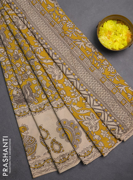 Kalamkari cotton saree yellow and beige with allover prints and long printed border