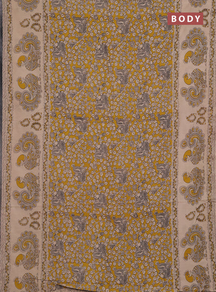Kalamkari cotton saree yellow and beige with allover prints and long printed border