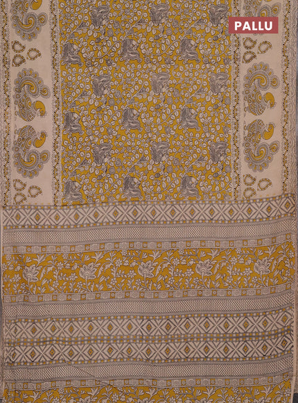 Kalamkari cotton saree yellow and beige with allover prints and long printed border