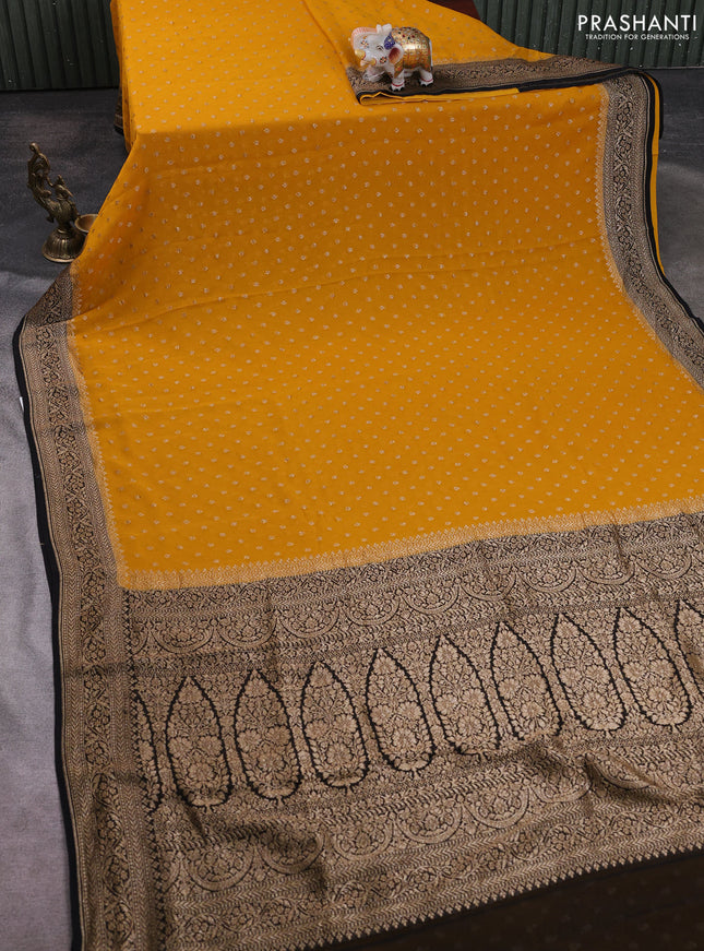 Banarasi georgette saree mustard yellow and black with allover thread & zari woven buttas and woven border
