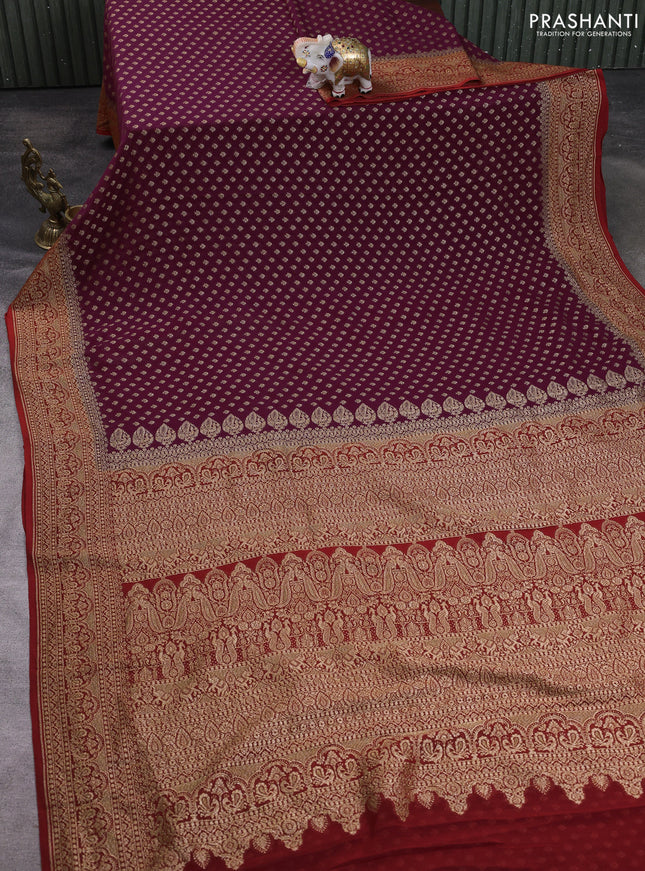 Banarasi georgette saree wine and rustic orange with allover thread & zari woven buttas and woven border