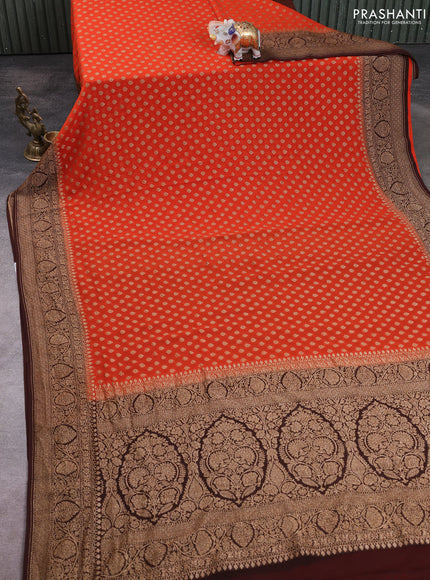 Banarasi georgette saree orange and coffee brown with allover thread & zari woven buttas and long woven border