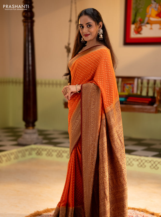 Banarasi georgette saree orange and brown with allover thread & zari woven buttas and long woven border