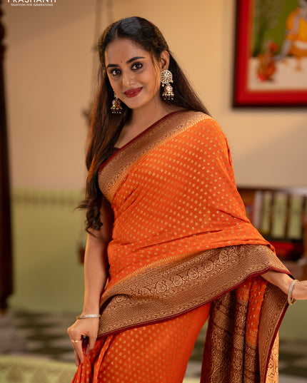 Banarasi georgette saree orange and brown with allover thread & zari woven buttas and long woven border