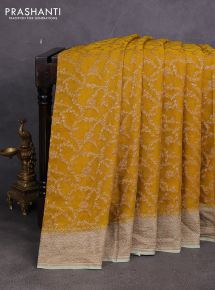 Banarasi georgette saree mustard yellow and pastel green with allover thread & zari weaves and woven border