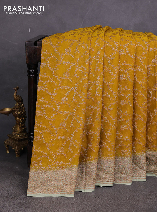 Banarasi georgette saree mustard yellow and pastel green with allover thread & zari weaves and woven border