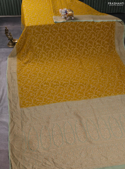 Banarasi georgette saree mustard yellow and pastel green with allover thread & zari weaves and woven border