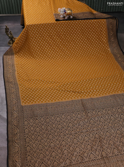 Banarasi georgette saree mustard yellow and black with allover thread & zari woven buttas and woven border