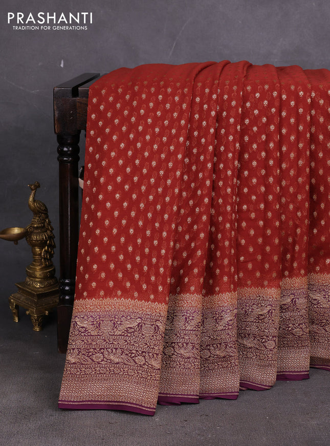 Banarasi georgette saree rustic orange and deep wine with allover thread & zari woven buttas and woven border