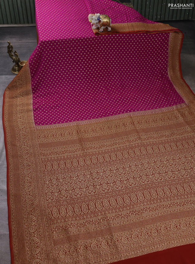 Banarasi georgette saree pink and rust shade with allover thread & zari woven buttas and long woven border