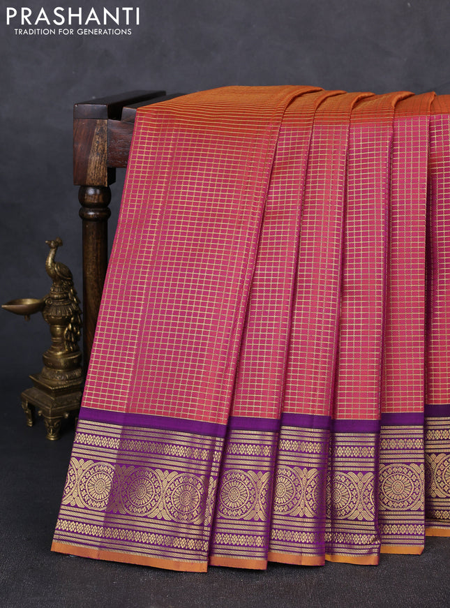 Pure kanchipuram silk saree dual shade of rustic orange and purple with allover zari woven checked pattern and rich zari woven border