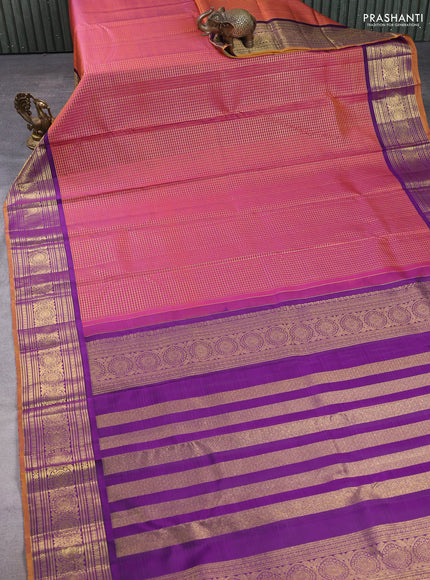 Pure kanchipuram silk saree dual shade of rustic orange and purple with allover zari woven checked pattern and rich zari woven border