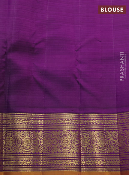 Pure kanchipuram silk saree dual shade of rustic orange and purple with allover zari woven checked pattern and rich zari woven border