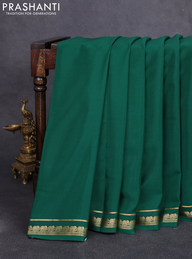 Pure mysore silk saree bottle green with plain body and small elephant zari woven border