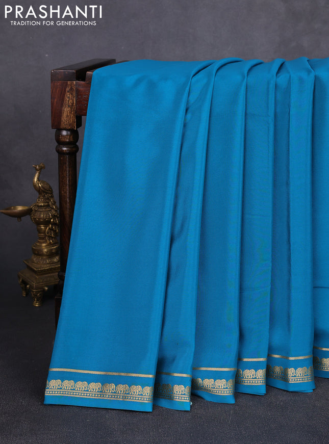 Pure mysore silk saree teal blue with plain body and small elephant zari woven border