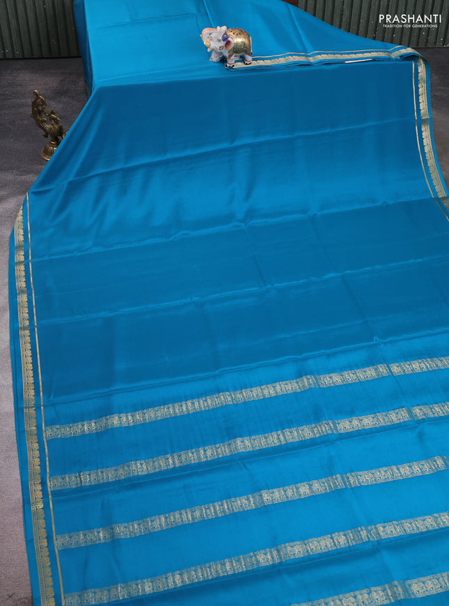 Pure mysore silk saree teal blue with plain body and small elephant zari woven border