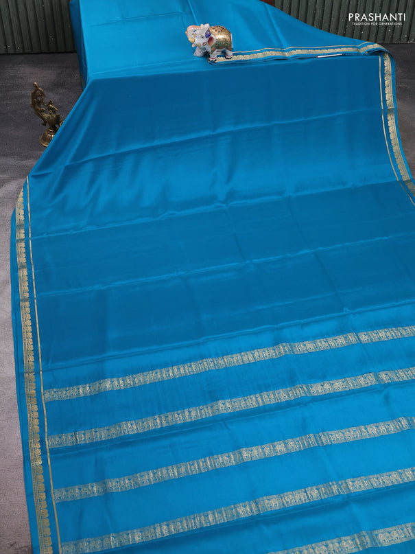 Pure mysore silk saree teal blue with plain body and small elephant zari woven border