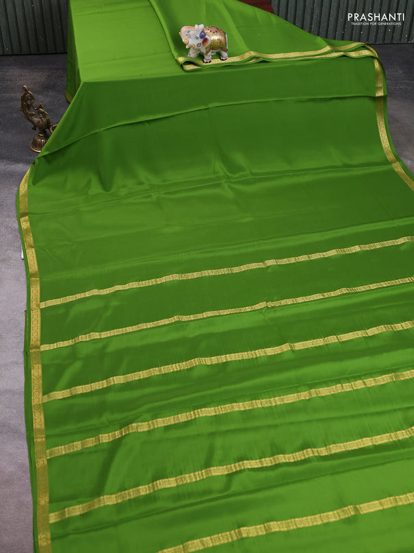 Pure mysore silk saree light green with plain body and small zari woven border