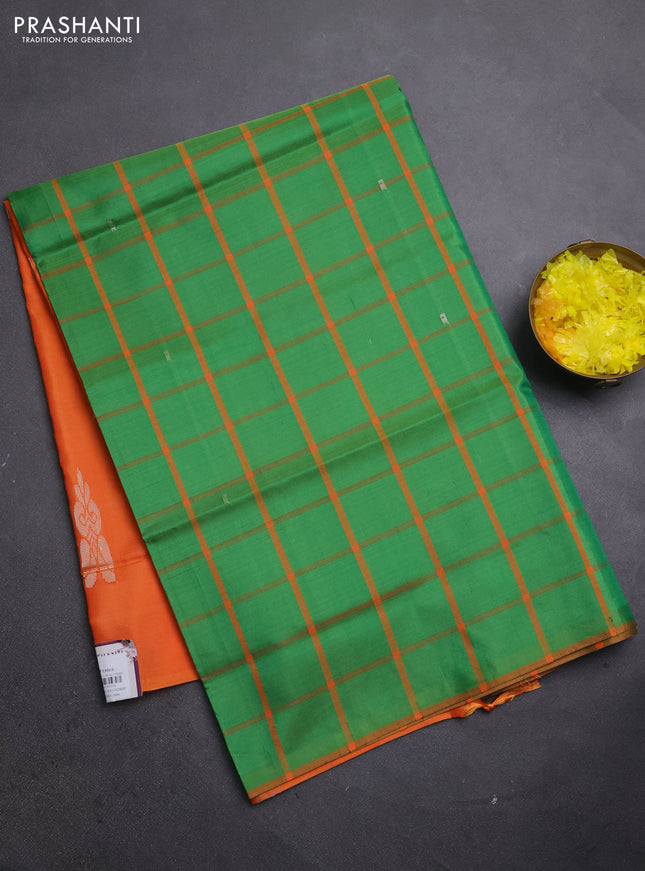 Banana pith saree green and orange with allover checks & thread woven buttas in borderless style