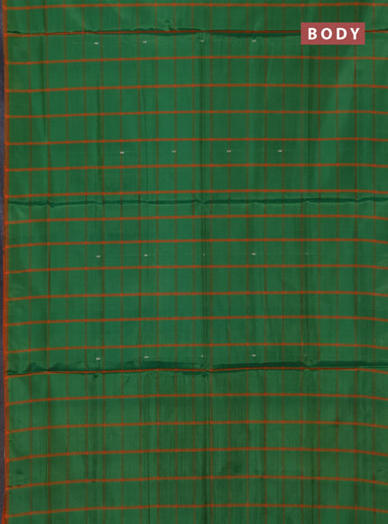 Banana pith saree green and orange with allover checks & thread woven buttas in borderless style