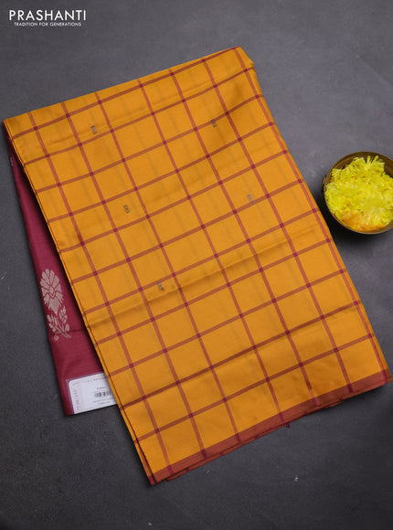 Banana pith saree mustard shade and maroon with allover checks & thread woven buttas in borderless style