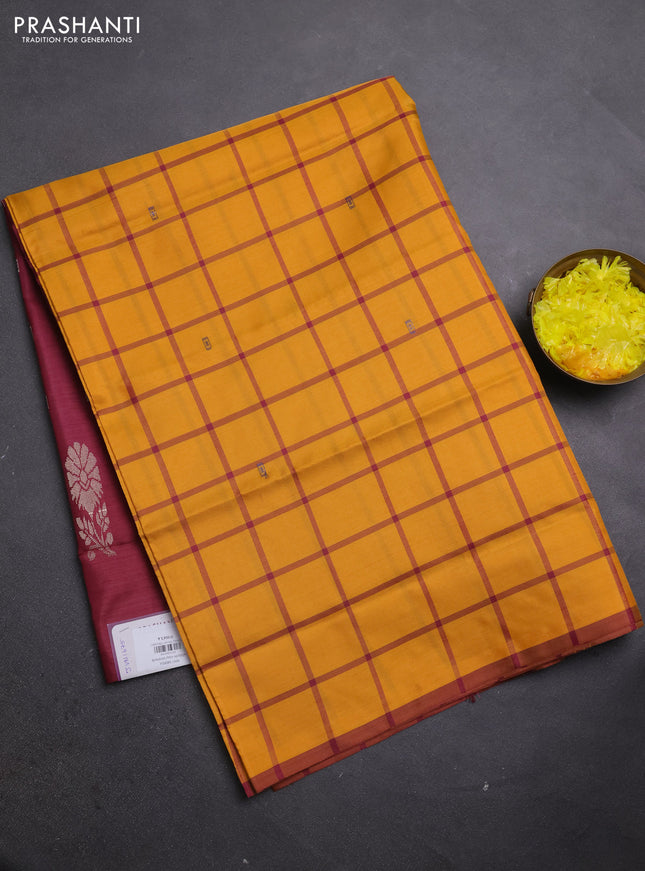 Banana pith saree mustard shade and maroon with allover checks & thread woven buttas in borderless style