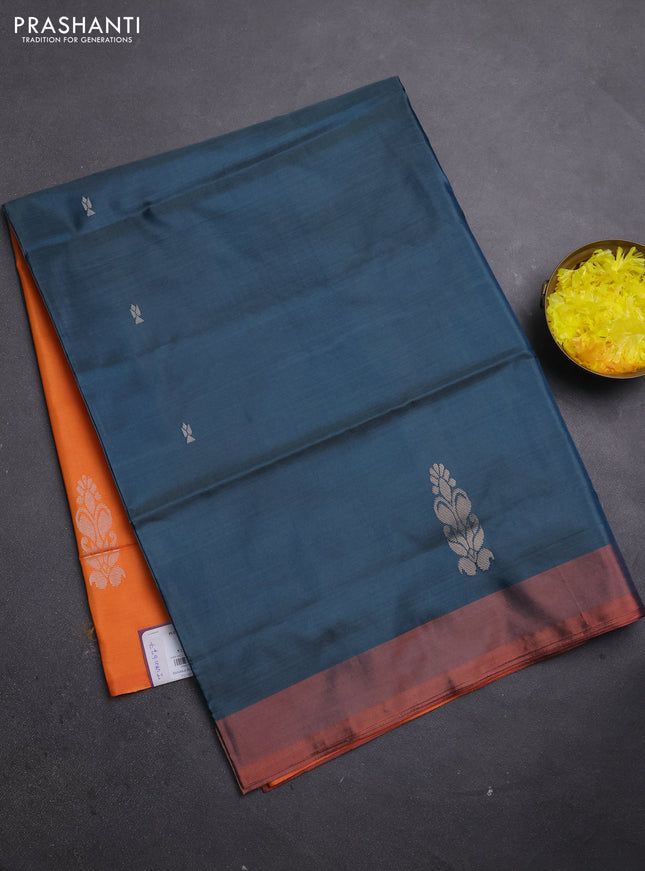 Banana pith saree peacock green and orange with thread woven buttas and simple border