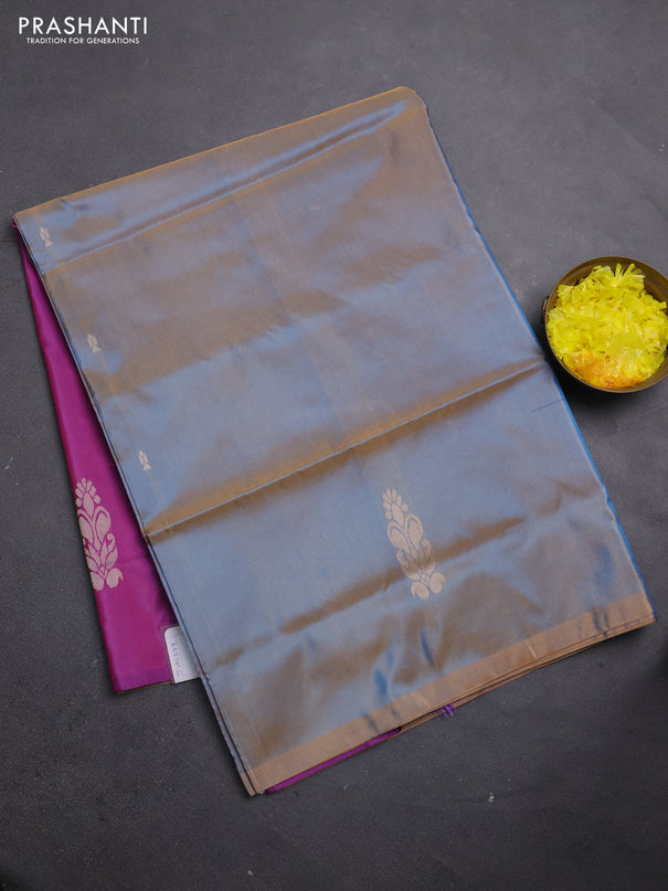 Banana pith saree dual shade of bluish orange and purple with thread woven buttas in borderless style
